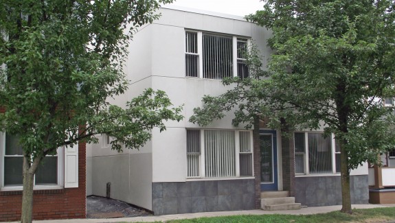 Exterior of two-story building with stucco