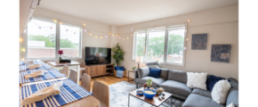 a living room filled with furniture and a flat screen tv