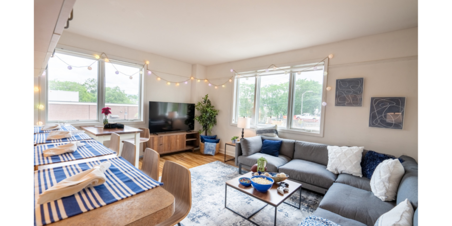 a living room filled with furniture and a flat screen tv