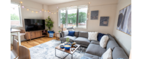 a living room filled with furniture and a flat screen tv