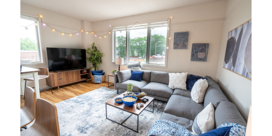 a living room filled with furniture and a flat screen tv