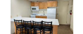 a kitchen with a center island and a breakfast bar