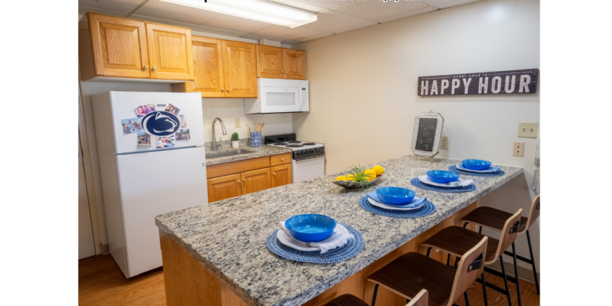 a kitchen with a counter top and a refrigerator