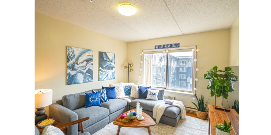 a living room filled with furniture and a large window