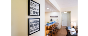 a hallway leading to a kitchen and living room