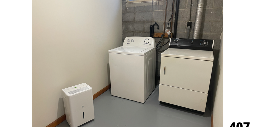 a washer and dryer in a small room