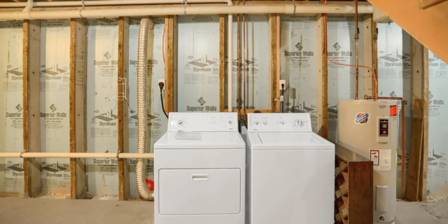 a dryer and dryer in a room under construction