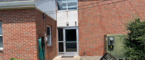 brick building with glass door and windows