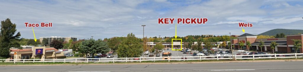 a parking lot with a sign that says key pick up