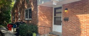 a brick house with a white front door