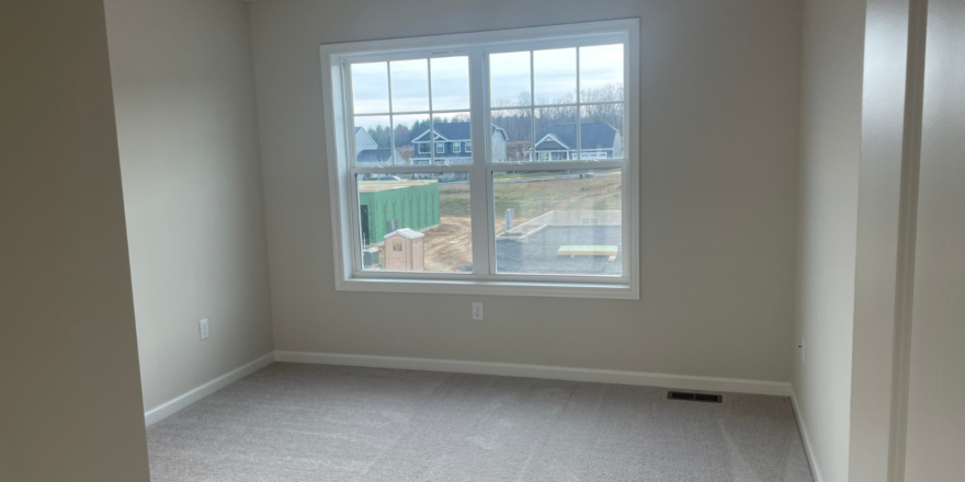 an empty room with a large window in it